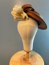 Bronze parasisal tilted hatinator with ivory flowers