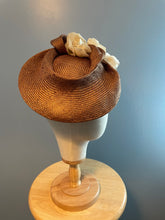 Bronze parasisal tilted hatinator with ivory flowers