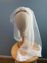 White pearl beaded linen bow bridal headpiece with veil