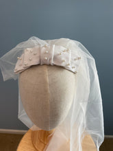 White pearl beaded linen bow bridal headpiece with veil